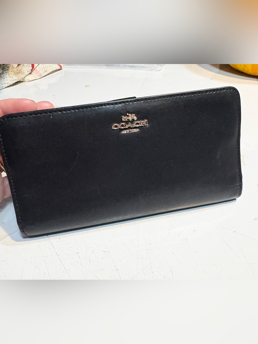 black leather Coach slim envelope or skinny wallet